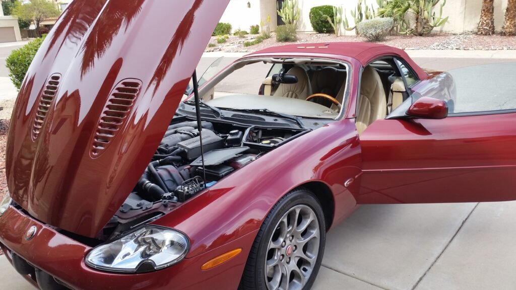Red Jaguar undergoing windshield replacement in Scottsdale, Arizona