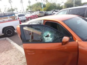 Side Window/Door Glass Replacement 1 Black Dodge Charger receiving mobile door glass replacement service in Mesa, Arizona