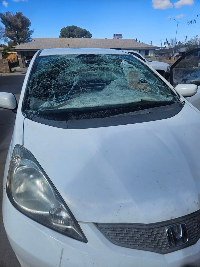 Severely shattered Honda Fit windshield requiring same-day mobile windshield replacement in Mesa, Arizona.