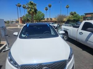 Kia Windshield Replacement | 1st Shot Auto Glass 2 2016 Kia Sorento windshield replacement in Scottsdale AZ with lane departure warning system and ADAS calibration stand setup for camera recalibration.