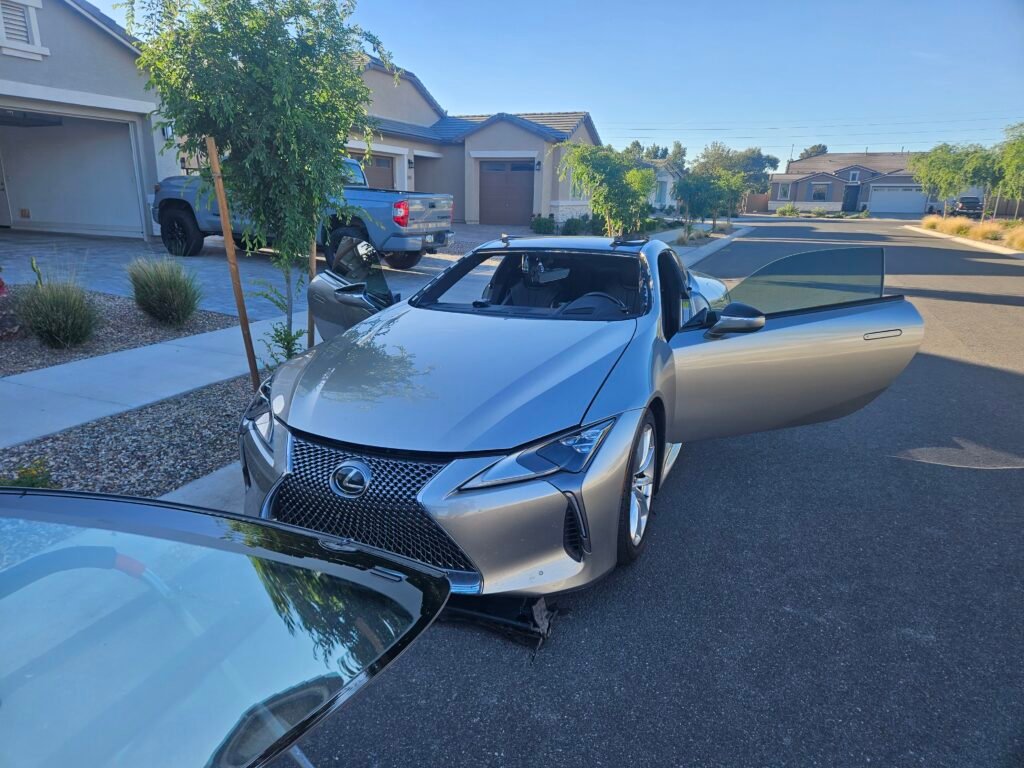 Silver 2018 Lexus LC500h during windshield removal and replacement process in Queen Creek, Arizona.