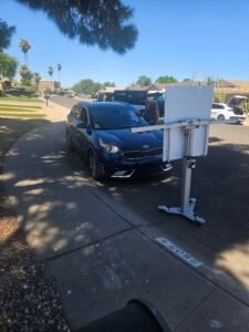 Windshield Replacement in Chandler, AZ 2 ADAS calibration in progress on a 2019 Kia Niro Hybrid after mobile windshield replacement in Chandler, Arizona.