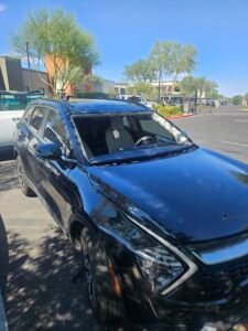 Windshield removed from a 2025 Kia Sportage during a mobile windshield replacement at a workplace in Gilbert, Arizona.