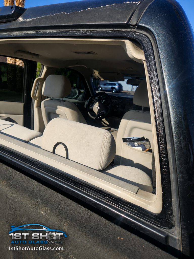 Prepared back glass opening on a 2009 GMC Sierra after cleanup and before urethane application in Chandler, AZ.