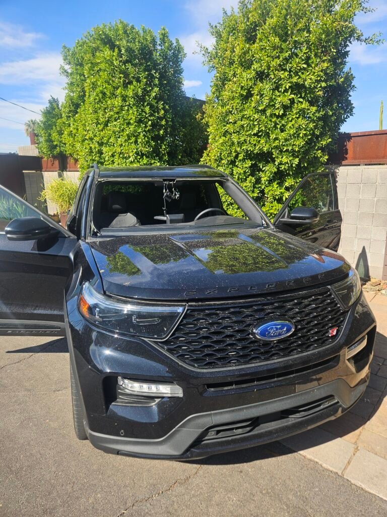 2023 Ford Explorer ST with windshield removed during mobile windshield replacement. Vehicle equipped with ADAS camera, rain sensor, and condensation sensor near the Phoenix and Scottsdale border.