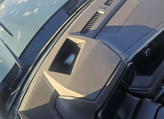 Mobile Windshield Replacement in Mesa, AZ & Greater Phoenix 4 Head-up display HUD projector in a 2026 Chevrolet Suburban Z71 during windshield replacement in Mesa AZ